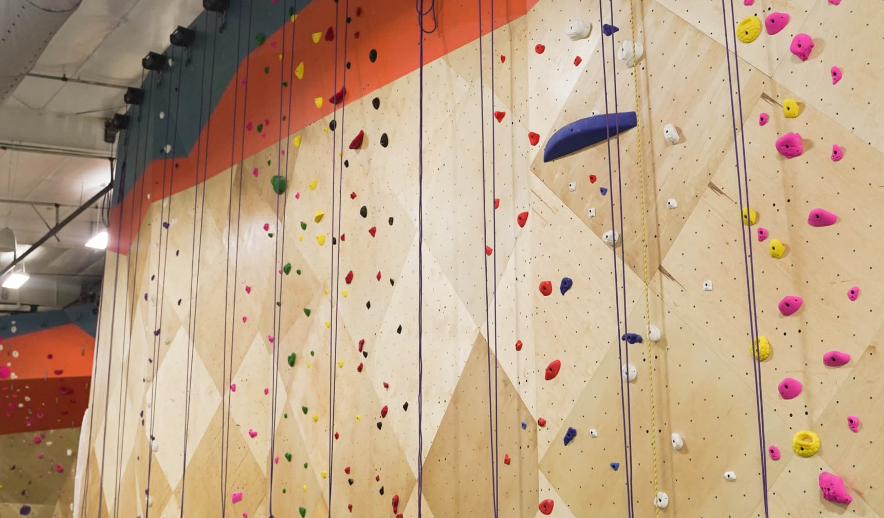 Rock climbing wall set with ropes and holds